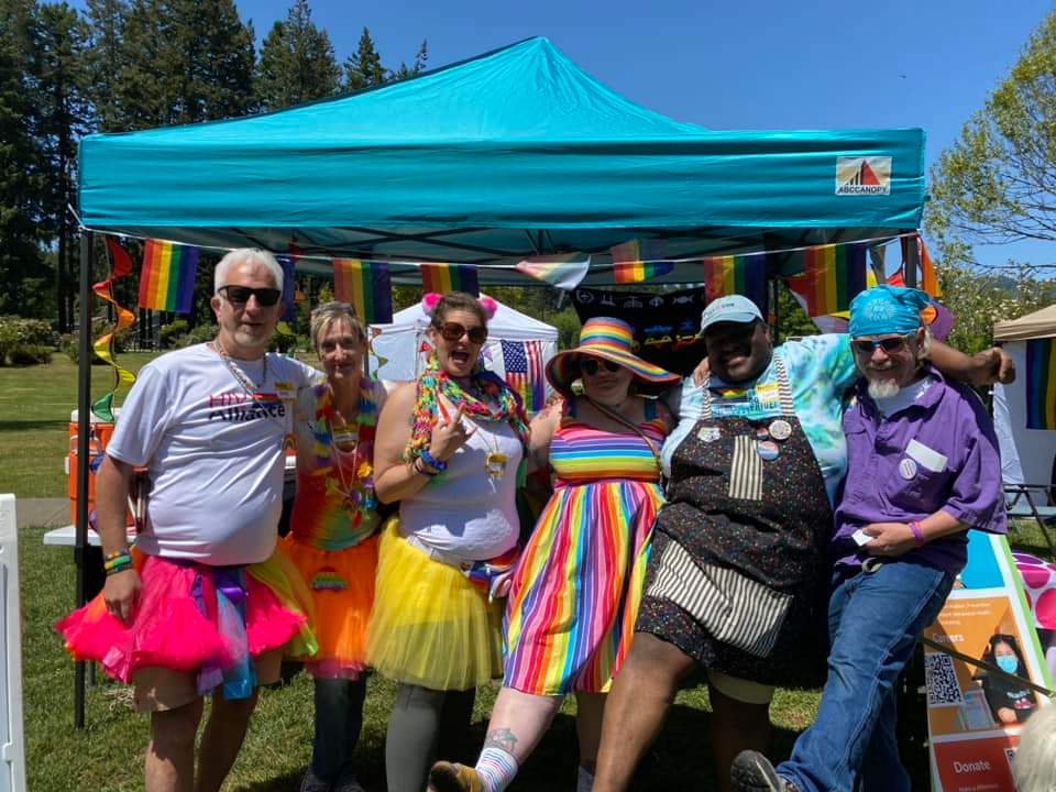 photo of people at a HIV tent at a festival offering scheduling for sti Testing