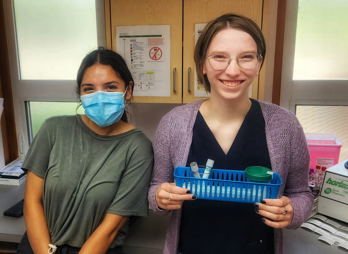 photo of two women helping with hiv treatment