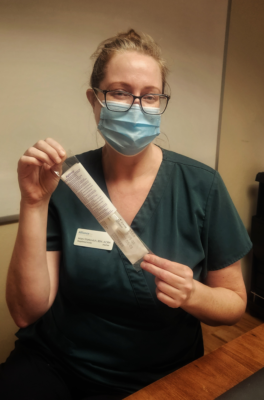 photo of a woman administering a kit for hiv treatment