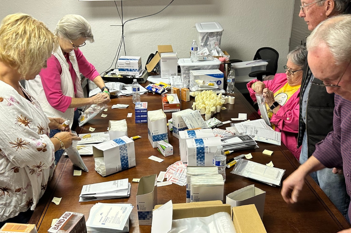 photo of volunteers packing harm Reduction kits